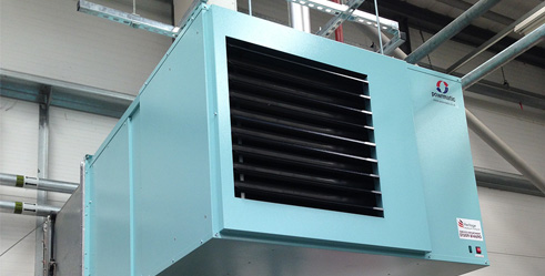 Suspended warm air heater in a commercial building